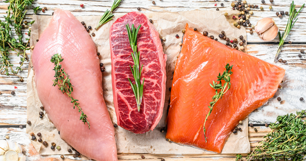 Three pieces of raw, uncooked seafood